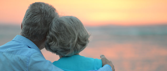 Senior couple looking at sea