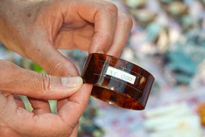 Bracelet made from the shell of an endangered hawksbill sea turtle illegally sold on a market of the Island of Derawan, East Borneo